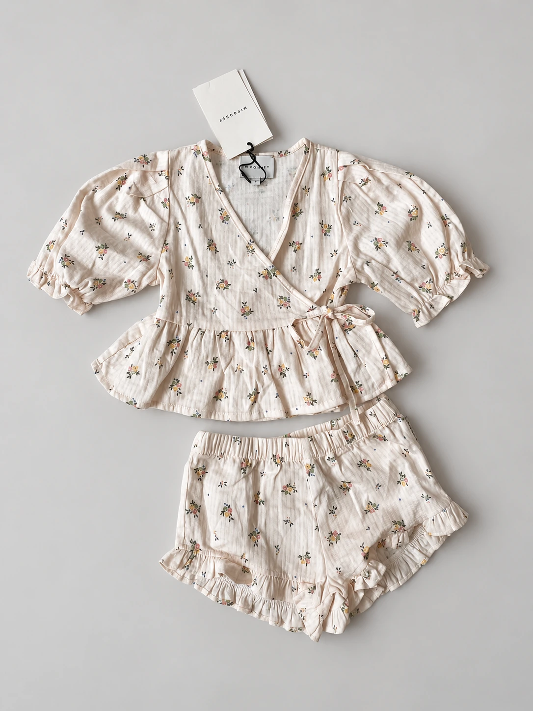 Mipounet floral wrap top and shorts, size 4 years, flat lay