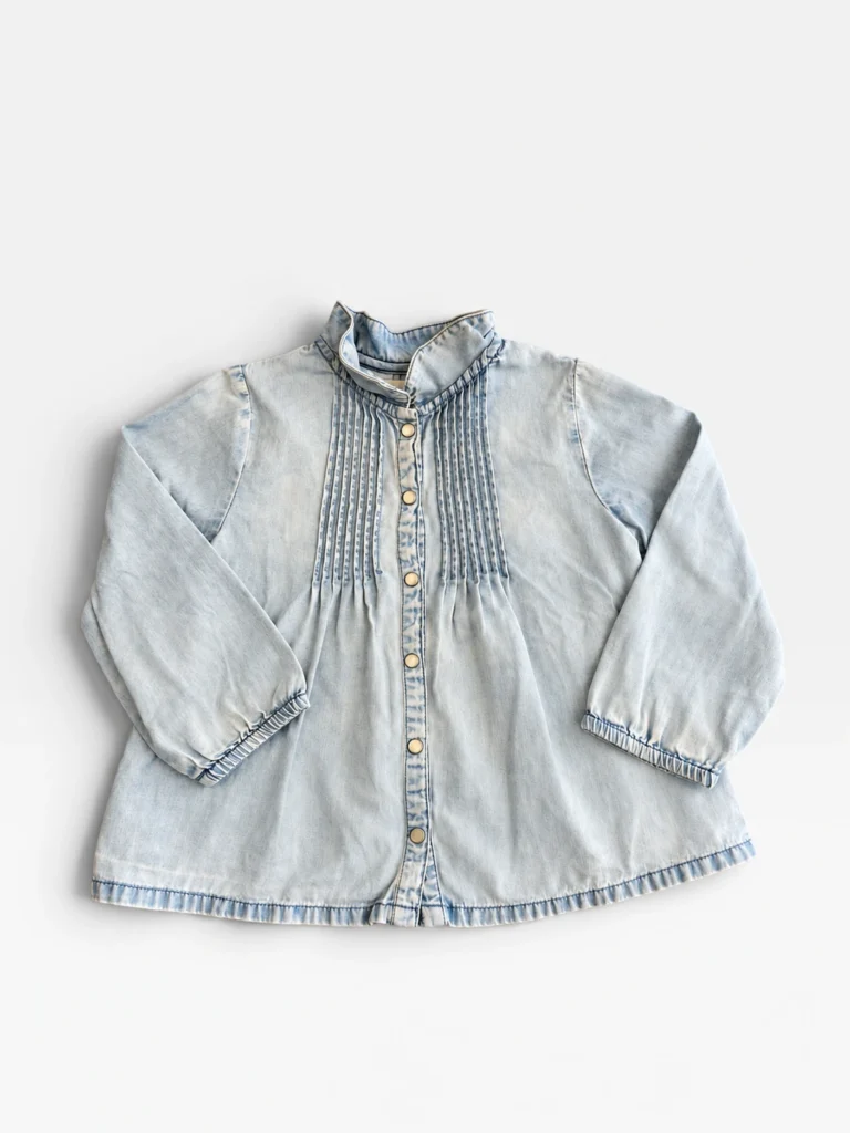 Boutchou pale blue washed denim blouse with pintucked bib, size 2 years